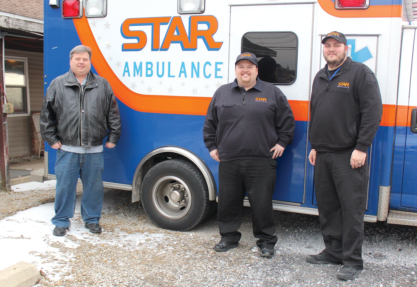 S.T.A.R. Ambulance owner and director Matt Peck, from left, braves the cold alongside son and fellow director Dave Peck, as well as paramedic Dustin Miller, at the southside ambulance center.